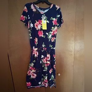 Cotton floral drawstring dress. Size M . Elastic and drawstring waist. Not worn